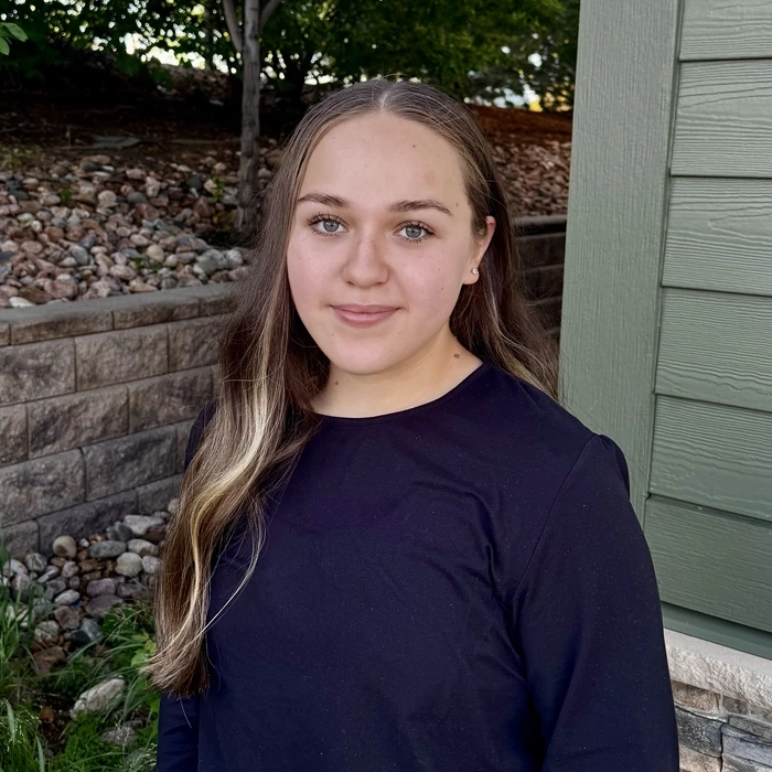 Portrait of a young woman, a team member at Green Dental Care.